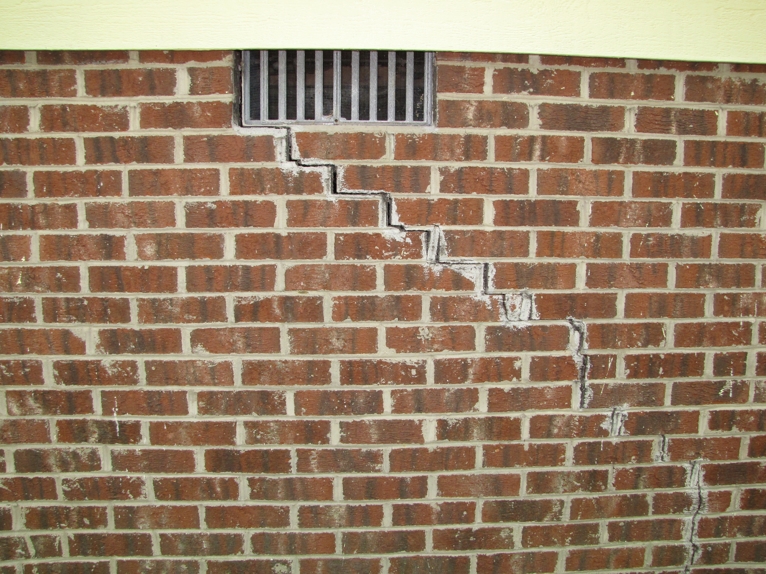 Cracked brick wall Cracked brick wall