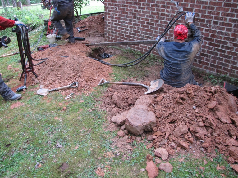 Crew member removing "filler mortar" Crew member removing "filler mortar"