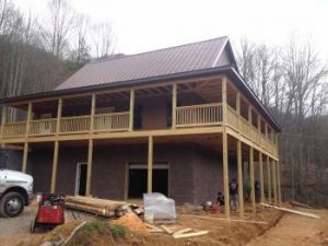 Large house in wooded area being built Large house in wooded area being built